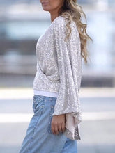 Load image into Gallery viewer, Tied Sequin Surplice Flare Sleeve Blouse