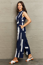 Load image into Gallery viewer, Printed Round Neck Cutout Jumpsuit with Pockets