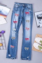 Load image into Gallery viewer, Sequin Bow Distressed Bootcut Jeans