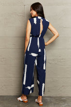 Load image into Gallery viewer, Printed Round Neck Cutout Jumpsuit with Pockets